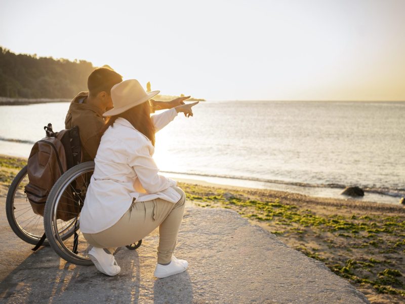 full-shot-couple-looking-sea